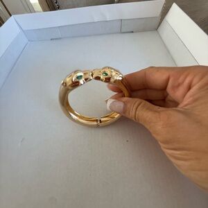 Gold Tone Panther Head Hinged Bangle Bracelet with Green Stone Eyes